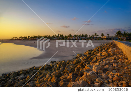 Sunset above Arabian Sea and a beach in Salalah, Oman Sunset above Arabian Sea and a beach in Salalah, Oman 109853026