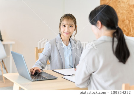 Business woman doing door-to-door sales Business woman doing door-to-door sales 109854252