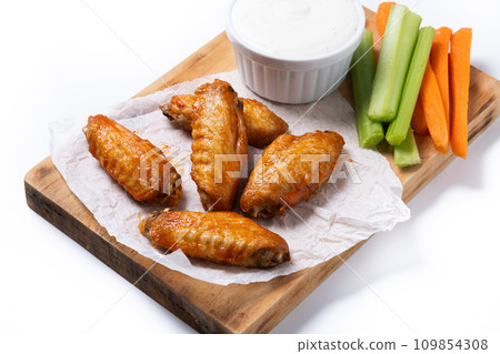 Buffalo spicy chicken wings with cayenne pepper sauce isolated on white background Buffalo spicy chicken wings with cayenne pepper sauce isolated on white background 109854308