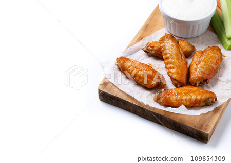 Buffalo spicy chicken wings with cayenne pepper sauce isolated on white background Buffalo spicy chicken wings with cayenne pepper sauce isolated on white background 109854309