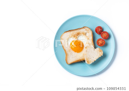 Valentine's Day breakfast with egg with tomatoes, heart shaped and toast bread isolated on white background 109854331