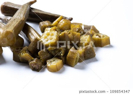Okra slices isolated on white background. Close up Okra slices isolated on white background. Close up 109854347