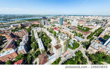 Aerial city view with roads, houses and buildings. Aerial city view with roads, houses and buildings. 109854659