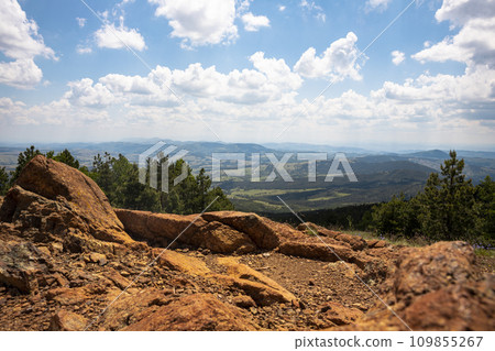Panoramic view from the mountain peak of the landscape and amazing blue cloudy sky. Divcibare mountain in Serbia 109855267