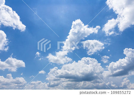White fluffy clouds in the bright blue sky White fluffy clouds in the bright blue sky 109855272