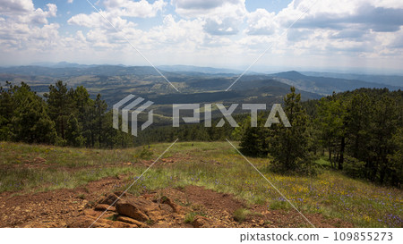 Panoramic view from the mountain peak of the landscape and amazing blue cloudy sky. Divcibare mountain in Serbia Panoramic view from the mountain peak of the landscape and amazing blue cloudy sky. Divcibare mountain in Serbia 109855273