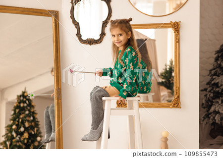 Cute long-haired girl having fun playing a good fairy 109855473