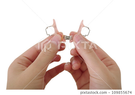 child's hand with orthotics 109855674