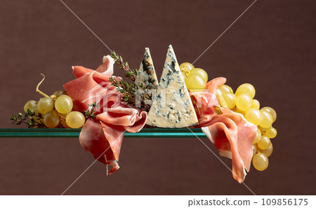 Grapes with blue cheese, prosciutto and thyme. 109856175