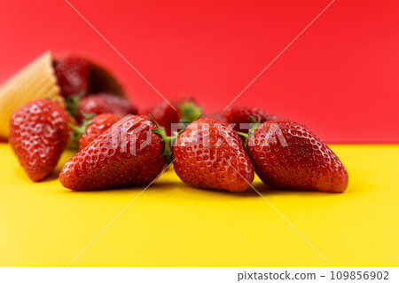 Ice cream cone with strawberries. Strawberry icecream. Healthy summer food concept 109856902