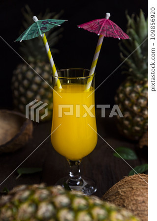 Pineapple juice in a glass with fresh pineapple fruits Pineapple juice in a glass with fresh pineapple fruits 109856920