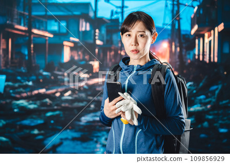 A woman evacuating after a disaster occurs A woman evacuating after a disaster occurs 109856929
