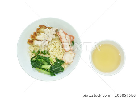 dry Chinese yellow egg noodles topping slice crispy and barbecue pork with cabbage on bowl eat couple clear soup dry Chinese yellow egg noodles topping slice crispy and barbecue pork with cabbage on bowl eat couple clear soup 109857596