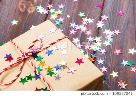 Simple christmas gift with red twine and decor stars Simple christmas gift with red twine and decor stars 109857841