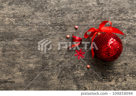Christmas ball on colored background. decoration bauble with ribbon bow with copy space Christmas ball on colored background. decoration bauble with ribbon bow with copy space 109858094