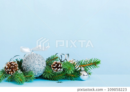 New Year Christmas tree toy, branches of a christmas tree, New Year decorations on a colored background New Year Christmas tree toy, branches of a christmas tree, New Year decorations on a colored background 109858223