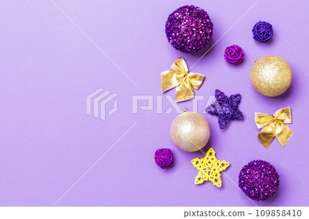 Top view of Christmas balls and creative decorations on colorful background with copy space. New Year concept 109858410