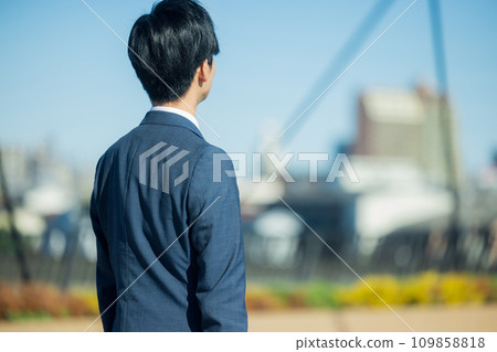 young man wearing a suit young man wearing a suit 109858818