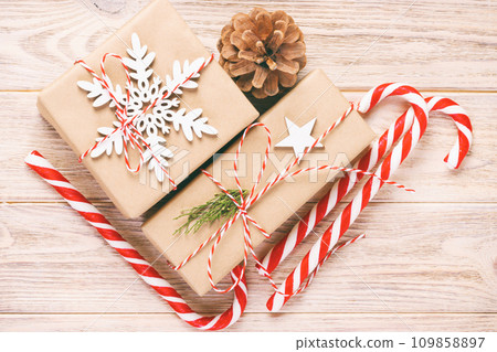 Christmas Decoration gift box with Candy Canes. Toned 109858897