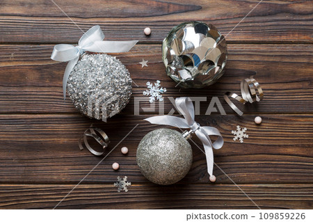 Christmas ball on colored background. decoration bauble with ribbon bow with copy space 109859226