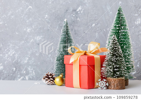 Christmas composition. craft Gift box, small tree, branches and craft DIY decorations on white background. New year concept. Christmas home decoration Flat lay, top view, copy space 109859278