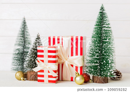 Christmas composition. craft Gift box, small tree, branches and craft DIY decorations on white background. New year concept. Christmas home decoration Flat lay, top view, copy space 109859282