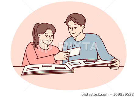 Happy couple man and woman looking at family photo album with pictures sits at table. Vector image Happy couple man and woman looking at family photo album with pictures sits at table. Vector image 109859528