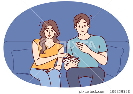 Couple relaxing at home watching movie 109859538