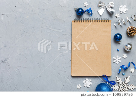 Christmas blank greeting card mock-up scene. Creative layout made of Christmas tree branches and paper card note. Flat lay. Nature New Year concept Christmas blank greeting card mock-up scene. Creative layout made of Christmas tree branches and paper card note. Flat lay. Nature New Year concept 109859786
