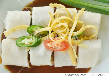 fresh Chinese spring roll made from flour wrapped tofu and pork with bean sprout dressing sweet red gravy sauce on plate fresh Chinese spring roll made from flour wrapped tofu and pork with bean sprout dressing sweet red gravy sauce on plate 109859799
