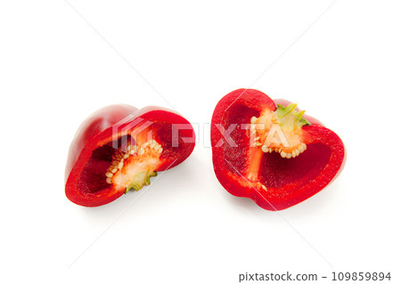 Halves of red bell pepper isolated on white background with clipping path. . Halves of red bell pepper isolated on white background with clipping path. . 109859894