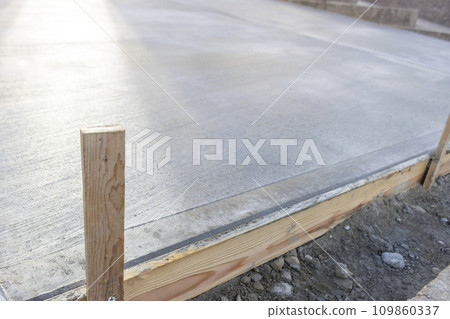 Garden of a private house 2 days after concrete curing Garden of a private house 2 days after concrete curing 109860337