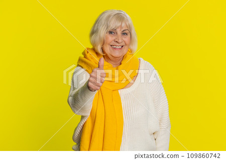 Senior woman raises thumbs up agrees gives positive reply recommends advertisement likes good idea Senior woman raises thumbs up agrees gives positive reply recommends advertisement likes good idea 109860742