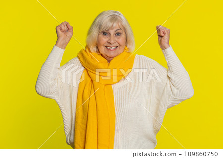 Happy senior woman celebrating success winning birthday lottery jackpot goal achievement good news 109860750
