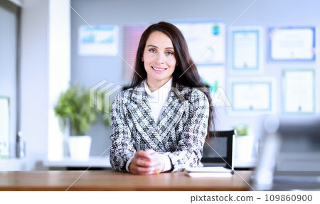 Smiling professional employee indoors Smiling professional employee indoors 109860900