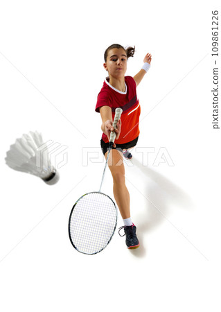 Full length portrait of badminton athlete in dynamic pose, training rigorously against white studio background. Concept of sport. 109861226
