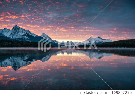 Rocky mountains with colorful sky reflection in Maligne Lake at Jasper national park, Canada 109862256