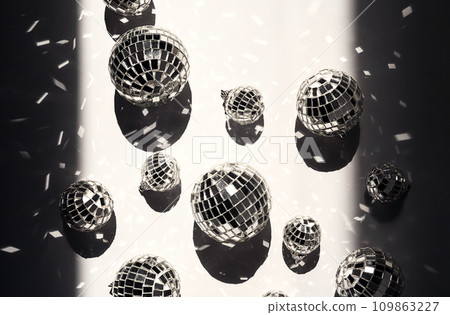 Sparkle silver disco balls flat lay. Festive retro party background. Sparkle silver disco balls flat lay. Festive retro party background. 109863227