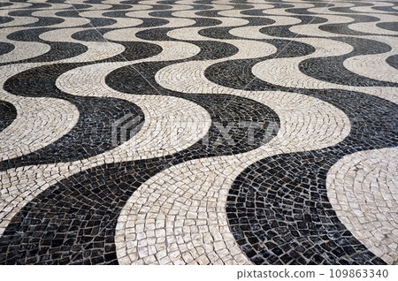 Wavy Pattern of Mosaic Tiles Pavement in Lisbon, Portugal. 109863340