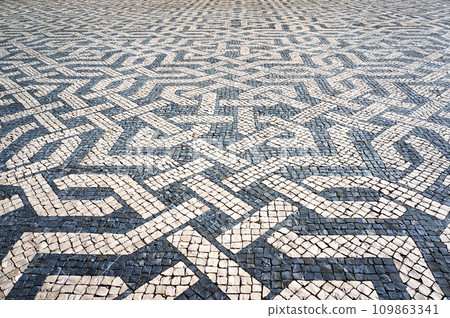 Geometric Pattern in Traditional Mosaic Paving Tiles in Lisbon, Portugal. 109863341