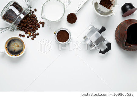 Ingredients for making coffee. Different ways to make coffee metal cezve, coffee machine capsules, drip and milk. Coffee making concept. Flat Lay. Top view. Copy space 109863522