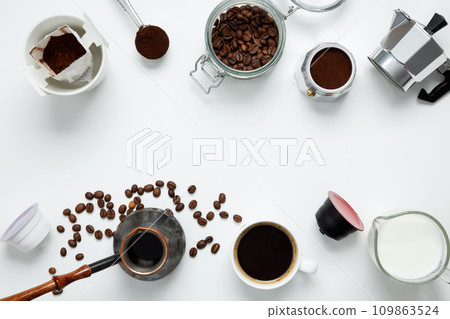 Ingredients for making coffee. Different ways to make coffee geyser moka maker, metal cezve, coffee machine capsules, drip. Coffee making concept. Flat Lay. Top view. Copy space Ingredients for making coffee. Different ways to make coffee geyser moka maker, metal cezve, coffee machine capsules, drip. Coffee making concept. Flat Lay. Top view. Copy space 109863524