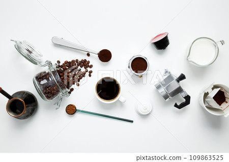 Ingredients for making coffee. Different ways to make geyser moka coffee maker, metal cezve, machine capsules. Coffee making concept. Flat Lay. Top view Ingredients for making coffee. Different ways to make geyser moka coffee maker, metal cezve, machine capsules. Coffee making concept. Flat Lay. Top view 109863525