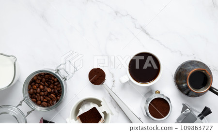 Ingredients for making coffee. Different ways to make coffee geyser moka maker, metal cezve, coffee machine capsules, drip. Coffee making concept. Flat Lay. Top view. Copy space Ingredients for making coffee. Different ways to make coffee geyser moka maker, metal cezve, coffee machine capsules, drip. Coffee making concept. Flat Lay. Top view. Copy space 109863727