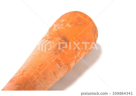Damaged non-standard carrots close-up white background 109864341