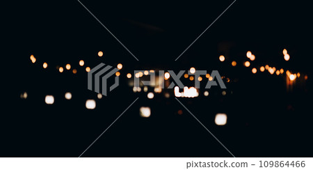 Decorative string lights at night time, Defocused Background, night city backdrop, party time with Yellow bokeh balls. 109864466
