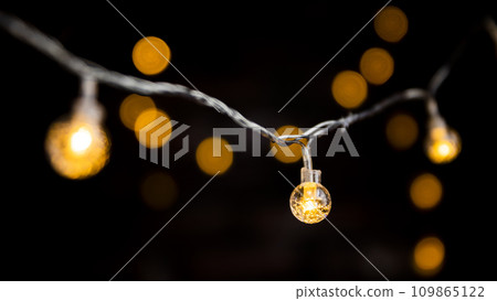 Christmas light bulbs shining in the dark Christmas light bulbs shining in the dark 109865122