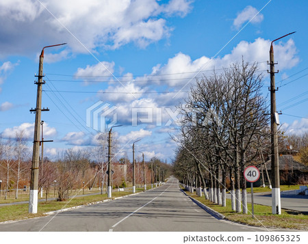 A rural road with a speed limit sign. A rural road with a speed limit sign. 109865325