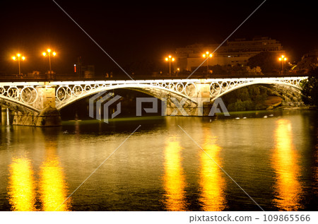 Triana Bridge illuminated at night. 109865566