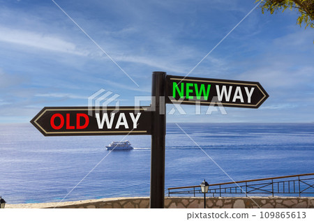 New or old way symbol. Concept word New way Old way on beautiful signpost with two arrows. Beautiful blue sea sky with clouds background. Business and new or old way concept. Copy space. New or old way symbol. Concept word New way Old way on beautiful signpost with two arrows. Beautiful blue sea sky with clouds background. Business and new or old way concept. Copy space. 109865613